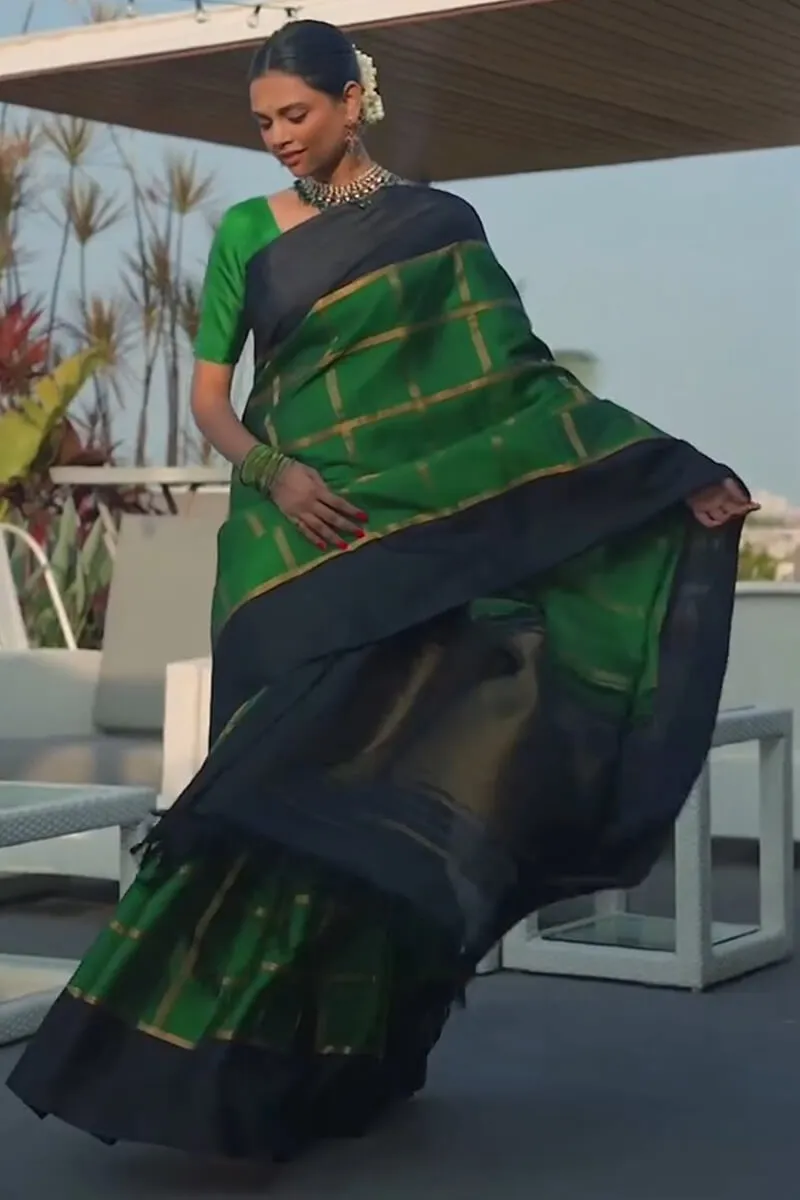 Sumptuous Dark Green Soft Silk Saree With Prominent Blouse Piece