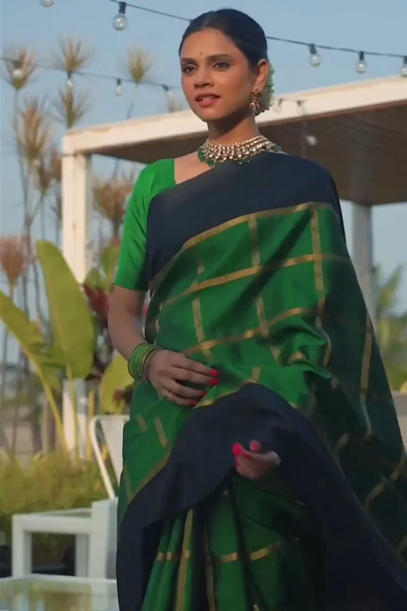 Sumptuous Dark Green Soft Silk Saree With Prominent Blouse Piece