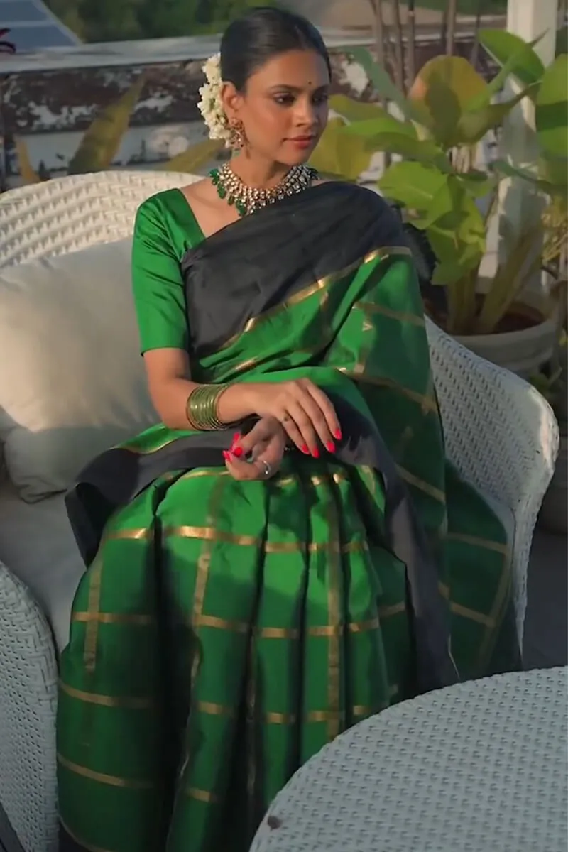 Sumptuous Dark Green Soft Silk Saree With Prominent Blouse Piece