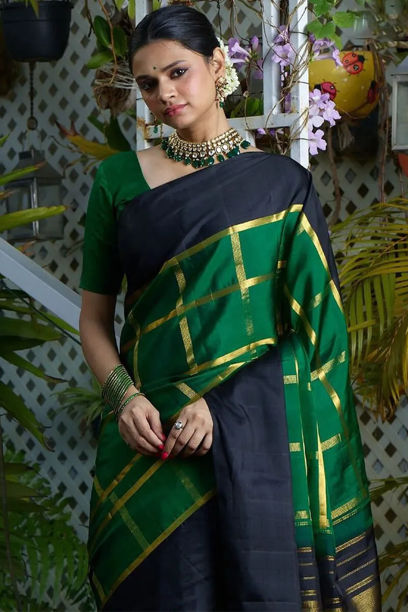 Sumptuous Dark Green Soft Silk Saree With Prominent Blouse Piece